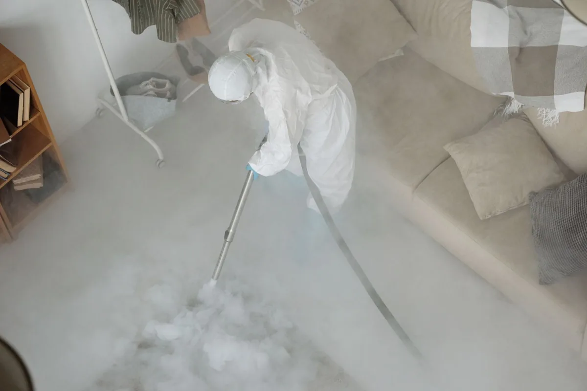 Biohazard cleanup technician in protective equipment, Harriman, TN